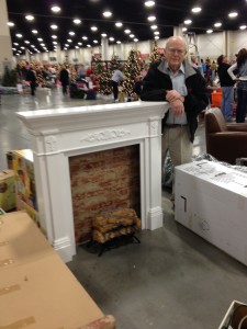 Dad poses with his handcrafted mantle