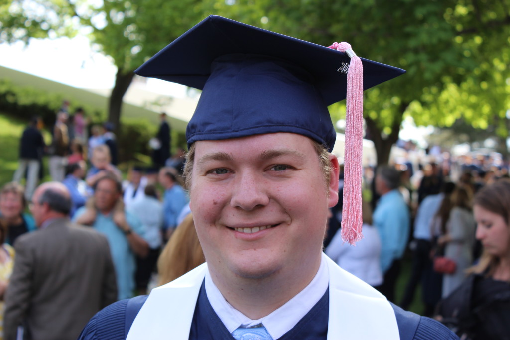 Mark outside the Marriott Center after commencement