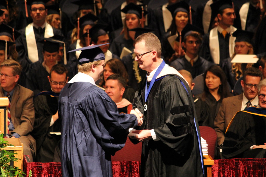 Mark receiving his diploma.